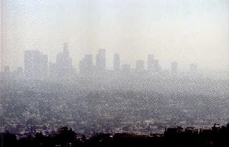 A city covered by a thick layer of smog.