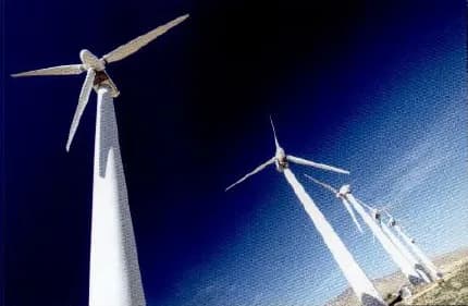 Wind turbines against a deep blue sky.