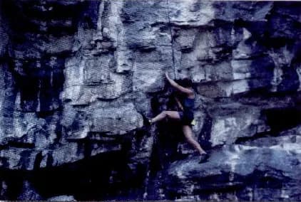 A climber on a steep rock face.