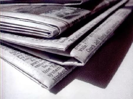 A pile of folded newspapers.