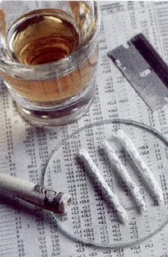 A glass of alcohol, a cigarette and lines of white powder (illegal drugs) on a newspaper page.