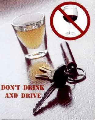 A “Don't drink and drive” poster with a glass of alcohol and a set of car keys.